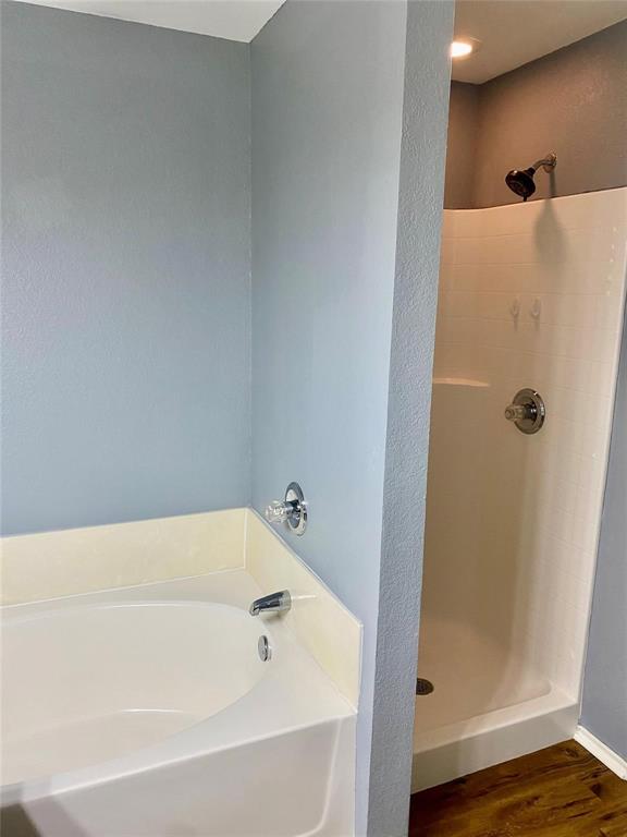 203 Jacinth Lane Granbury, TX 76049 - Photo 13 of 20 a bathroom with a bathtub