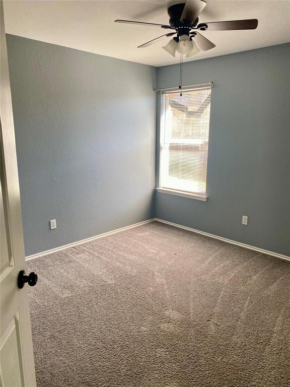 203 Jacinth Lane Granbury, TX 76049 - Photo 18 of 20 a view of an empty room with a window