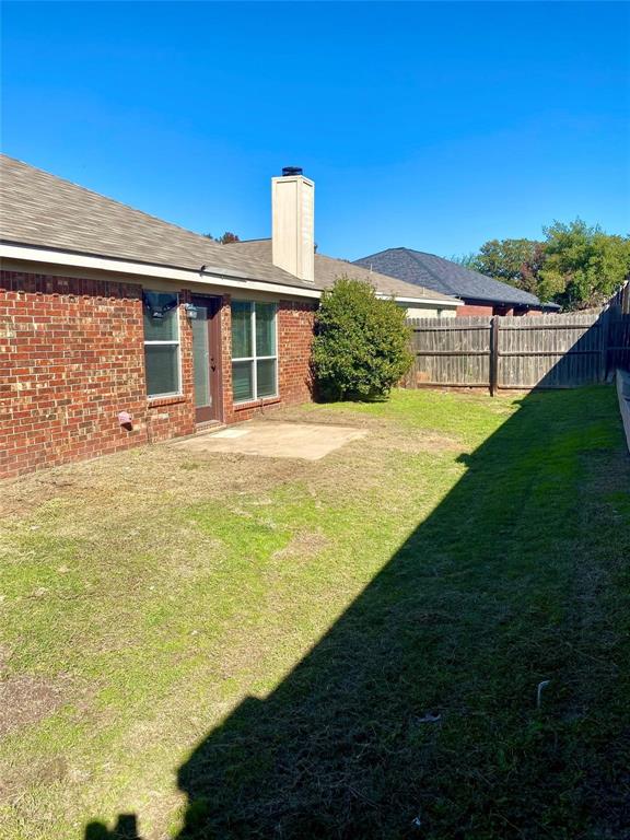 203 Jacinth Lane Granbury, TX 76049 - Photo 20 of 20 a front view of a house with a yard