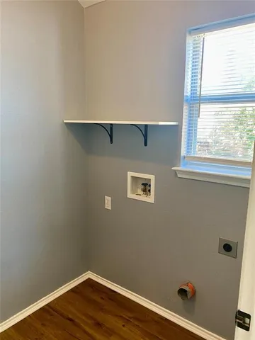 a view of a air conditioner and window in a room
