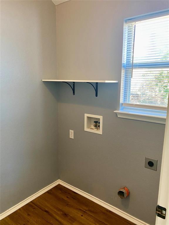 203 Jacinth Lane Granbury, TX 76049 - Photo 10 of 20 a view of a air conditioner and window in a room