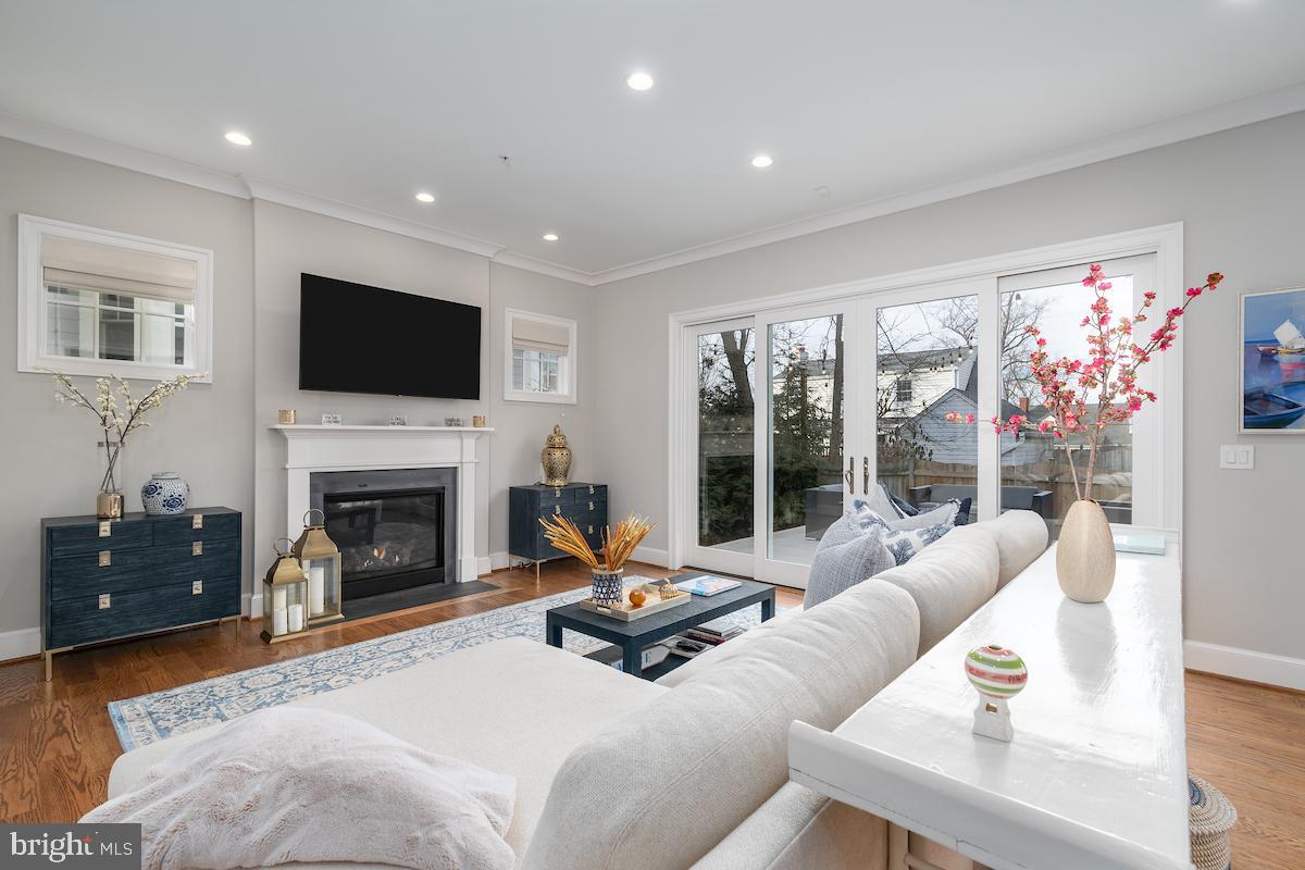 4621 Chestnut Street Bethesda, MD 20814 - Photo 15 of 45 Gas fireplace with french doors