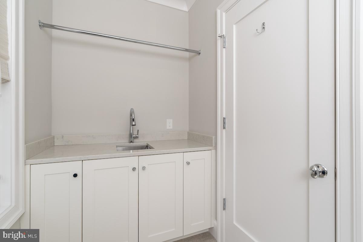 4621 Chestnut Street Bethesda, MD 20814 - Photo 34 of 45 Second level full size laundry with sink