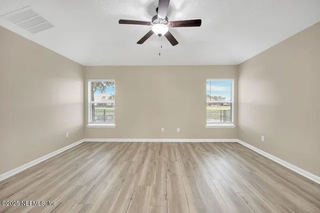 a view of a room with balcony and ocean view