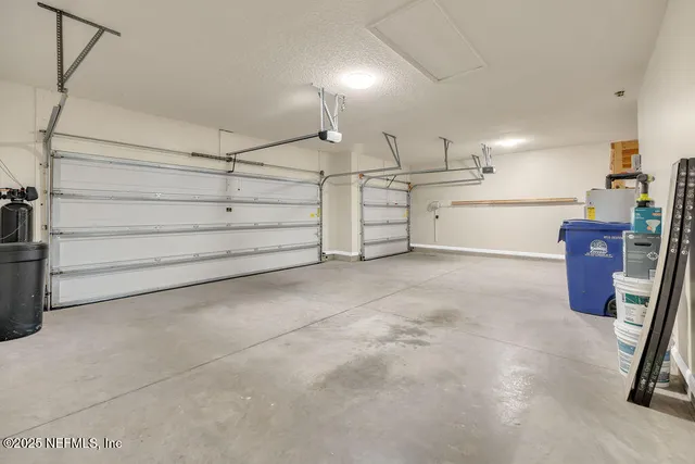 a bathroom with a granite countertop sink and a toilet