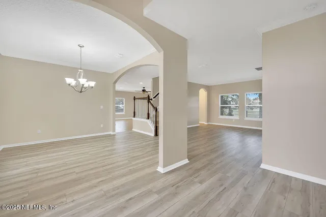 a front view of house with a garden