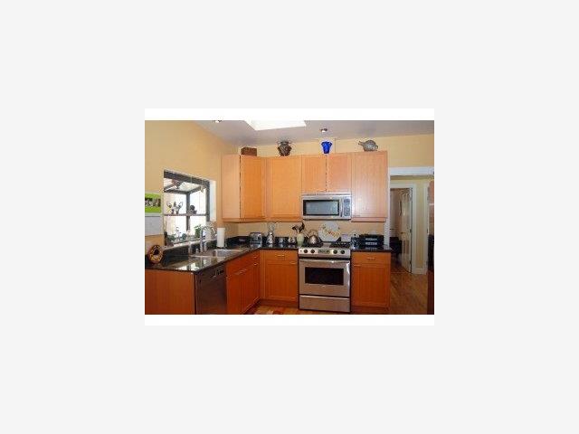 537 View Street Mountain View, CA 94041 - Photo 4 of 9 a open kitchen with stainless steel appliances granite countertop a sink and a refrigerator