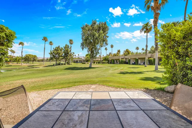a view of a golf course with a big yard