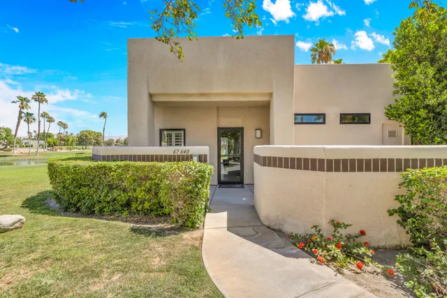 swimming pool view with a garden space