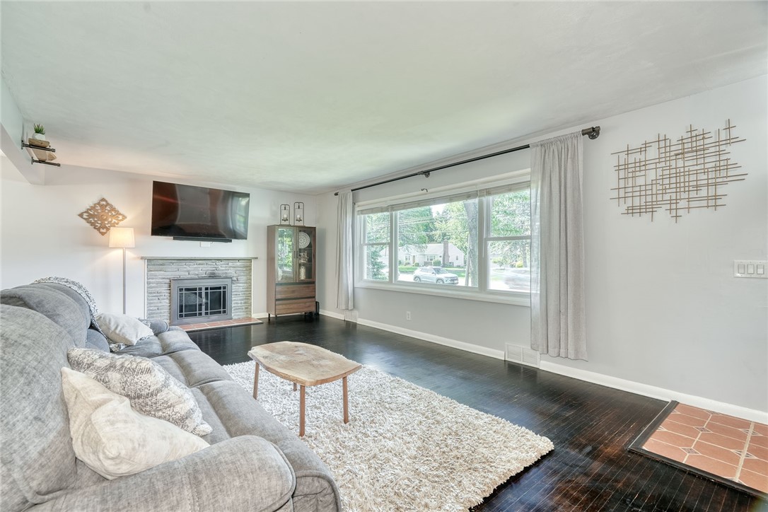 1038 Whalen Road Penfield, NY 14526 - Photo 5 of 46 spacious! family room with wood burning fireplace