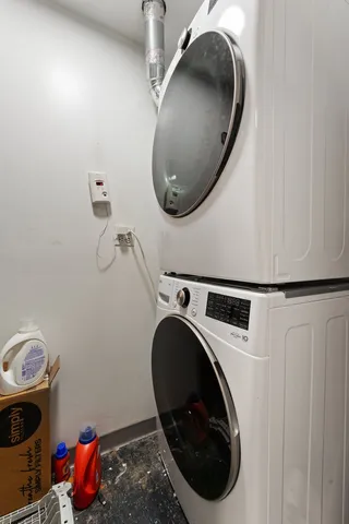 a close view of a utility room with dryer and washer