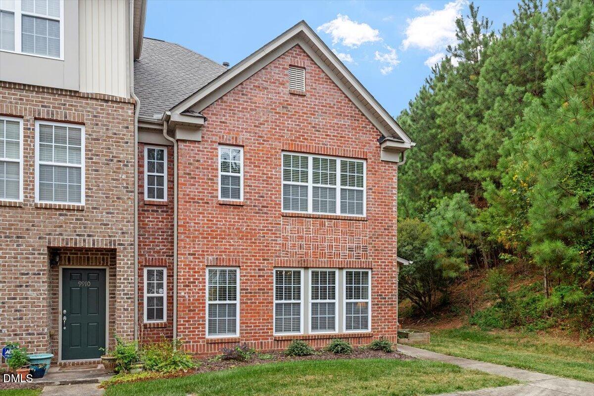 9912 Wasser Court Raleigh, NC 27617 - Photo 3 of 7 a front view of a house with garden