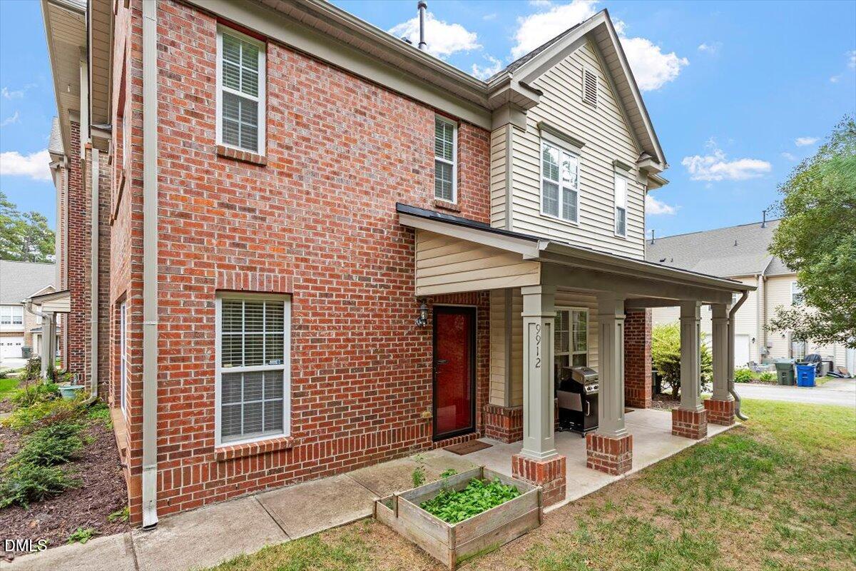 9912 Wasser Court Raleigh, NC 27617 - Photo 4 of 7 a front view of a house with garden