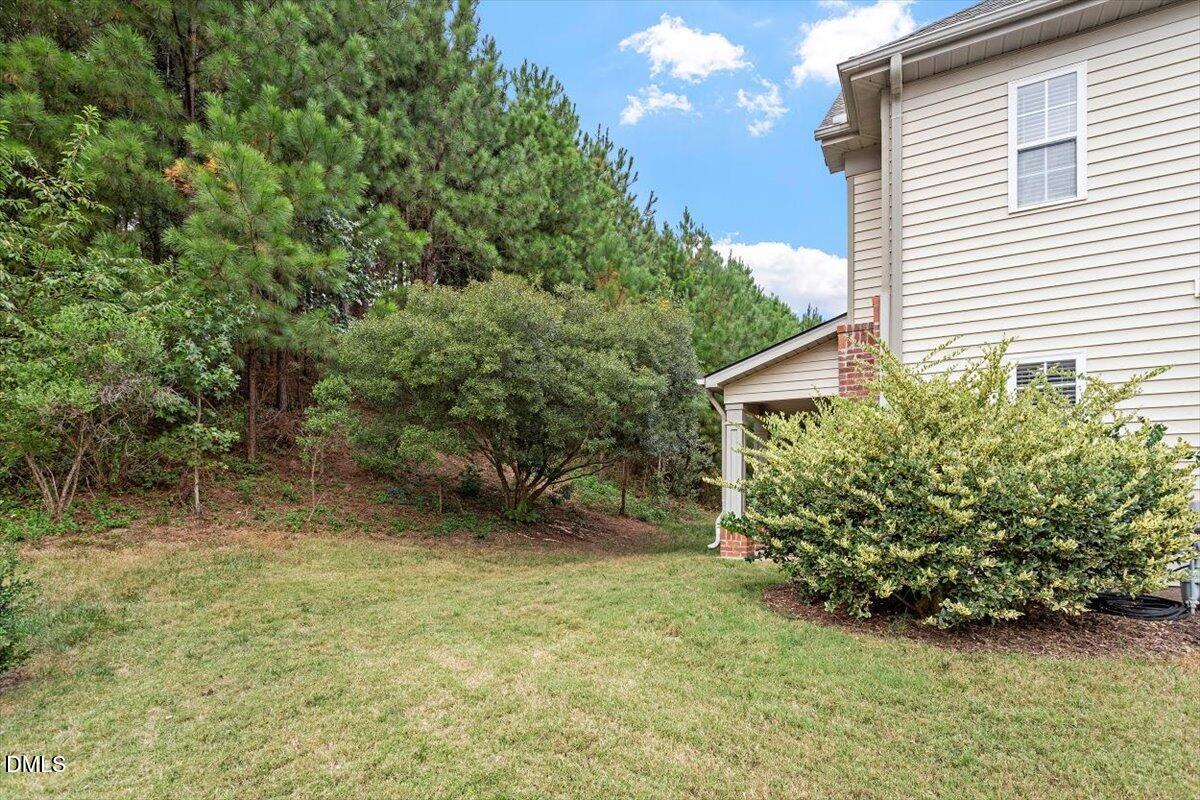 9912 Wasser Court Raleigh, NC 27617 - Photo 7 of 7 a view of a house with a yard