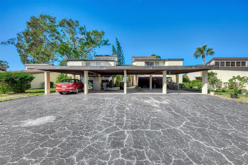 724 White Pine Tree Road, Unit 83 Venice, FL 34285 - Photo 1 of 1 a view of a car park in front of a building