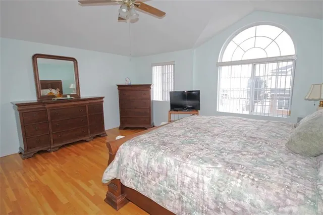 a bedroom with a bed and a dresser