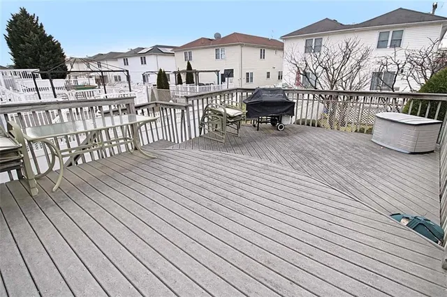 a view of a house with wooden deck
