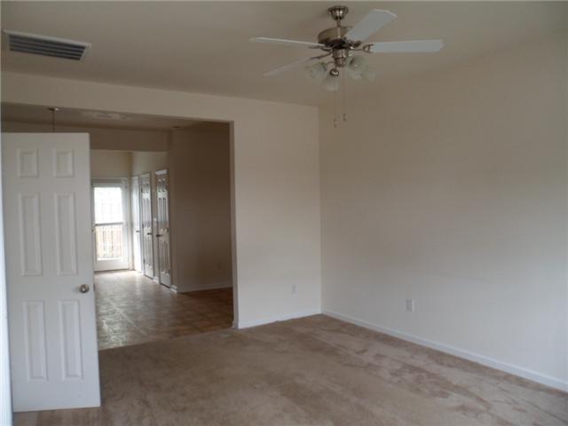 4022 Clinton Lane Spring Hill, TN 37174 - Photo 2 of 16 an empty room with windows and fan