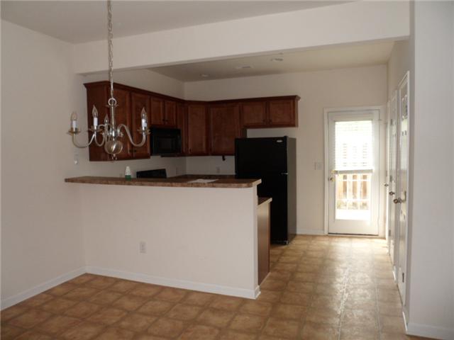 4022 Clinton Lane Spring Hill, TN 37174 - Photo 5 of 16 a kitchen with refrigerator and window
