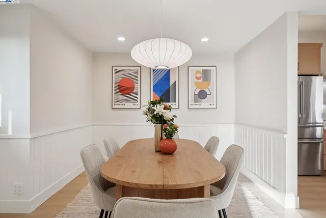 a dining room with furniture and window