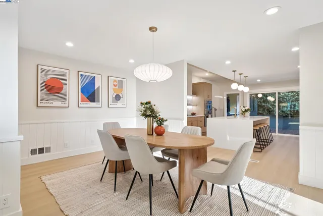 a bedroom with a large bed and a view of living room