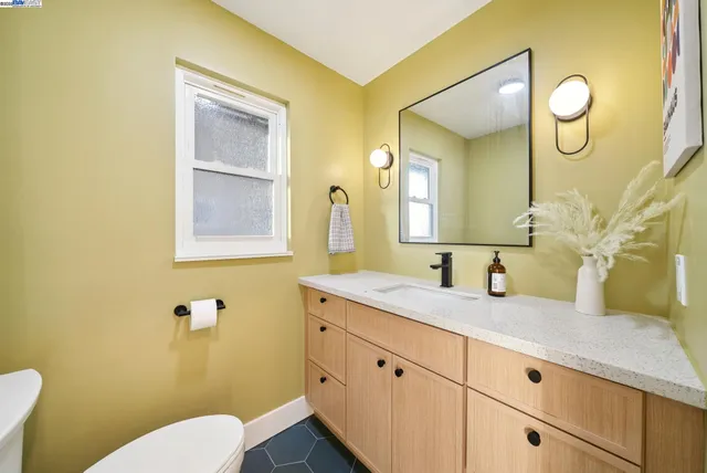 a bathroom with a sink a mirror and a shower