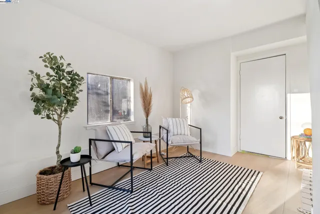 a view of a backyard with sitting area