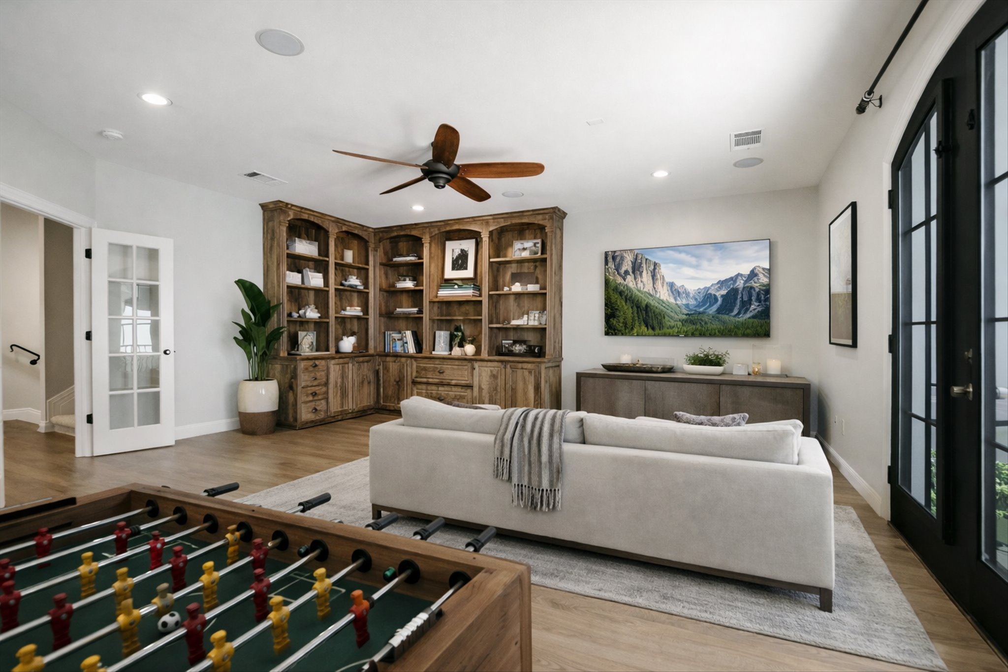 1910 Rue De St Tropez, Unit 4 Austin, TX 78746 - Photo 14 of 36 Game room featuring french doors, wood finished floors, a ceiling fan, and recessed lighting