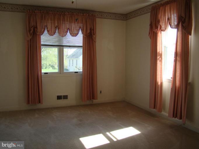 4113 Cliffvale Road Nottingham, MD 21236 - Photo 2 of 8 an empty room with windows