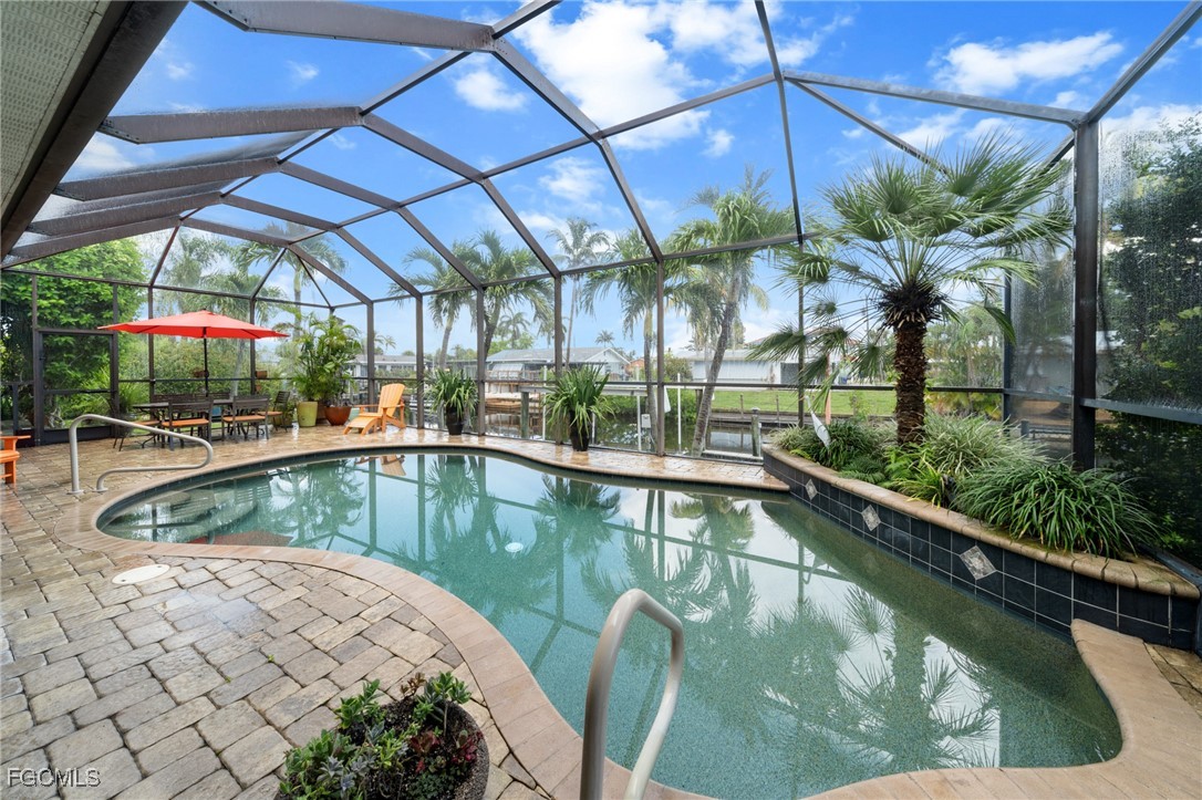 4424 North Bay Circle North Fort Myers, FL 33903 - Photo 2 of 43 a view of a swimming pool with a patio