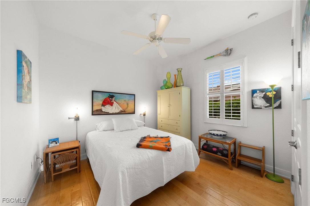 4424 North Bay Circle North Fort Myers, FL 33903 - Photo 22 of 43 a bedroom with furniture and a window