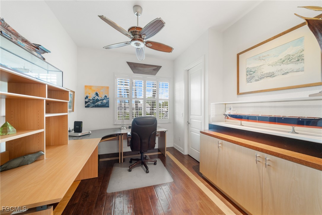 4424 North Bay Circle North Fort Myers, FL 33903 - Photo 24 of 43 a view of a workspace with furniture and a window