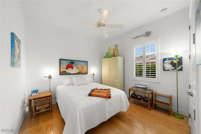 a bedroom with furniture and a window