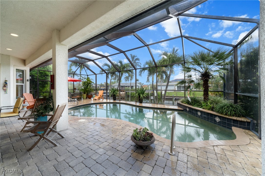 4424 North Bay Circle North Fort Myers, FL 33903 - Photo 30 of 43 a view of a swimming pool with a patio