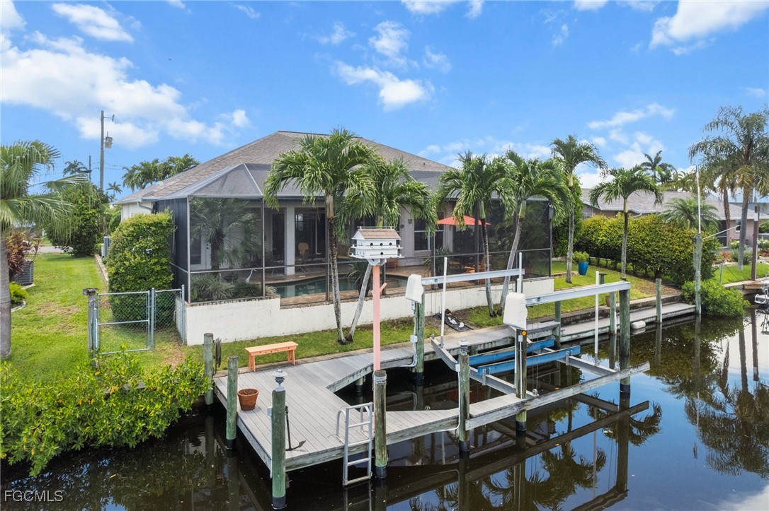 4424 North Bay Circle North Fort Myers, FL 33903 - Photo 3 of 43 a view of a swimming pool with chairs