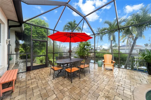 an outdoor space with furniture and umbrella
