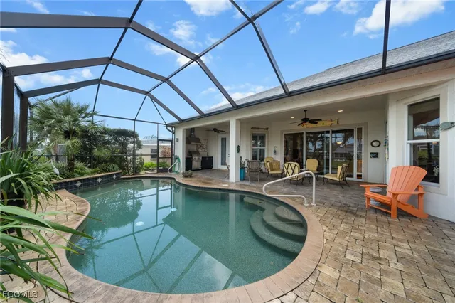 a view of a swimming pool with seating space