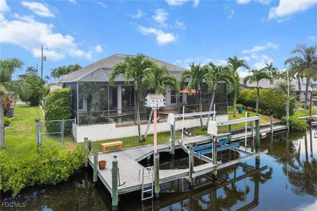 a view of a swimming pool with chairs