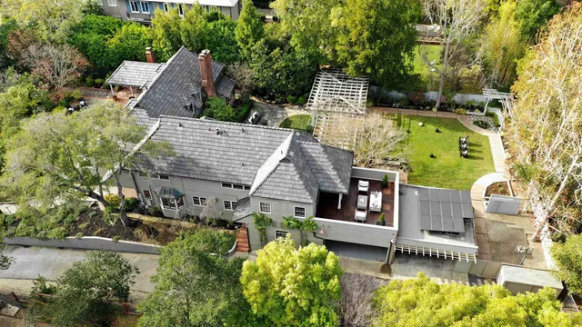 a view of house with a yard and sitting area