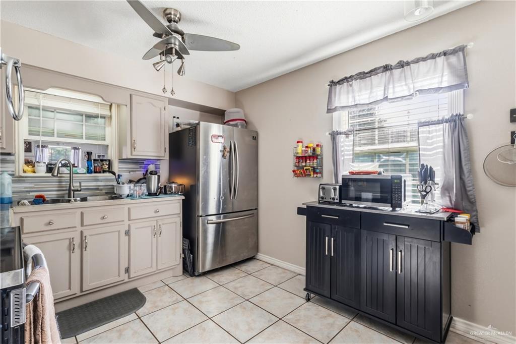 2124 Hawk Avenue McAllen, TX 78504 - Photo 4 of 18 a kitchen with appliances cabinets and a window