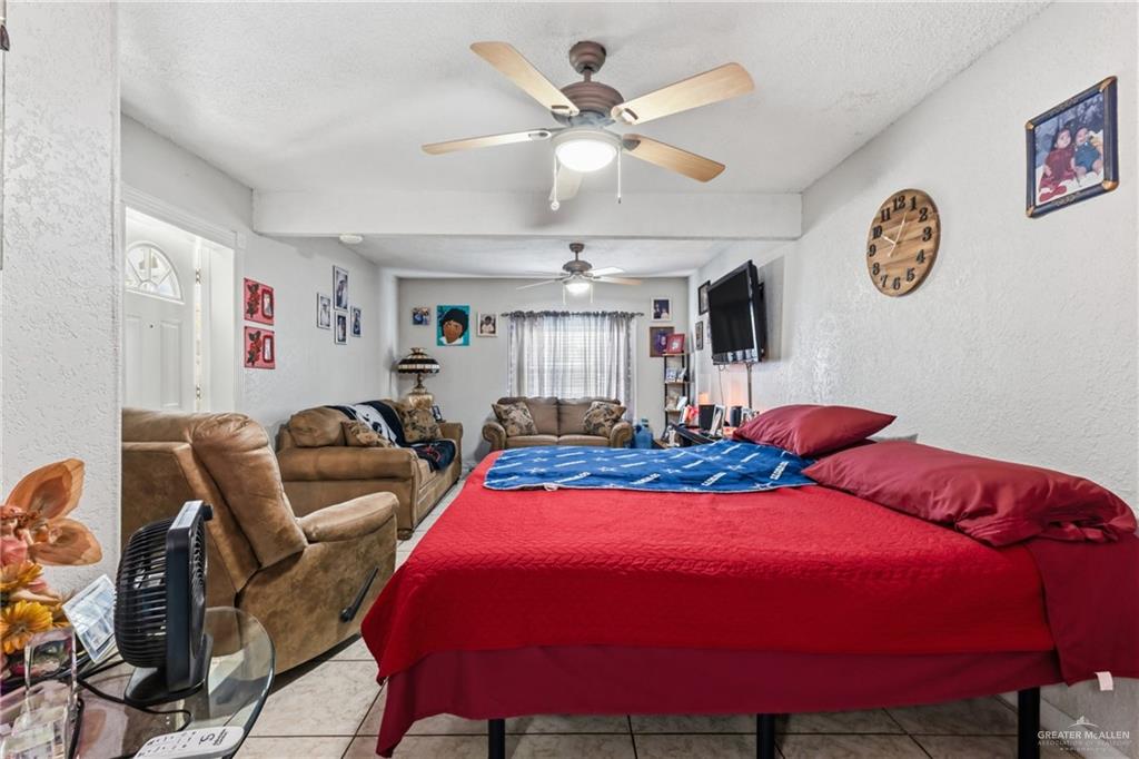 2124 Hawk Avenue McAllen, TX 78504 - Photo 8 of 18 a bed room with two bed and paintings on wall