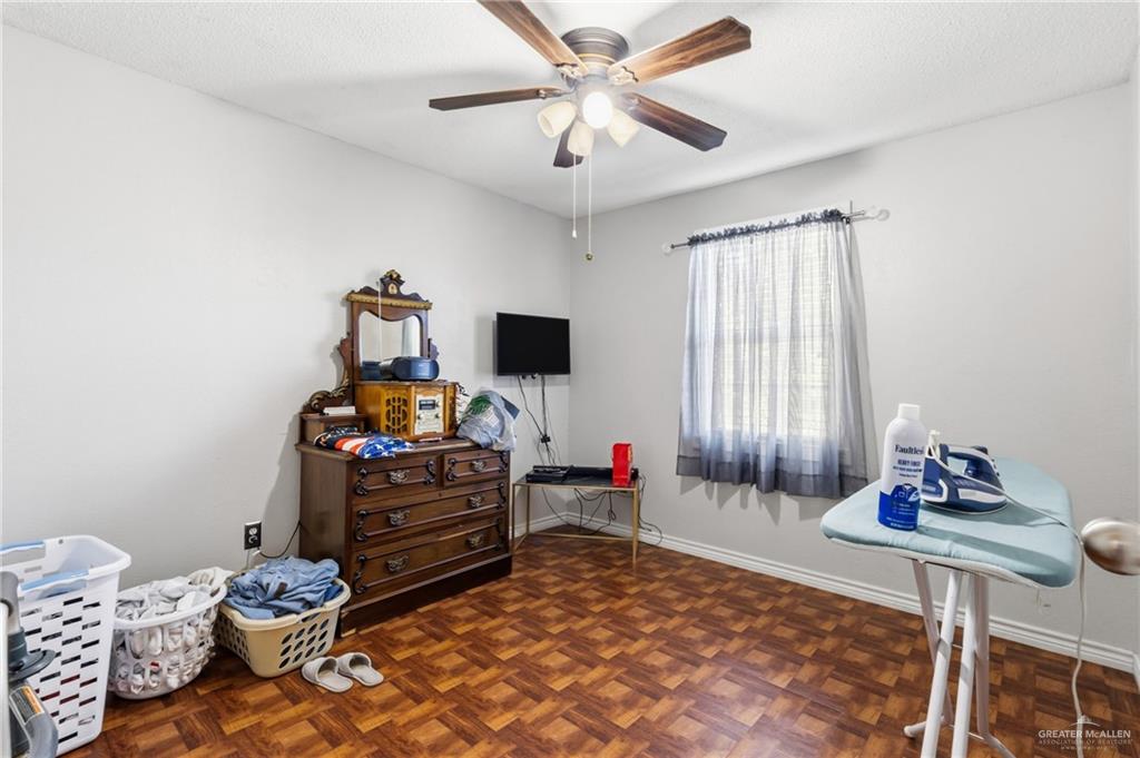 2124 Hawk Avenue McAllen, TX 78504 - Photo 10 of 18 a bedroom with a bed and a window