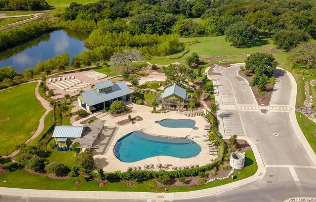 an aerial view of a house with outdoor space swimming pool and outdoor seating