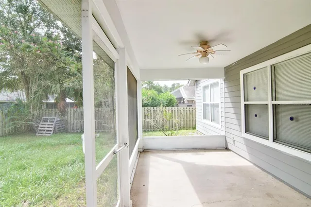 a spacious bedroom with a large bed and a tv