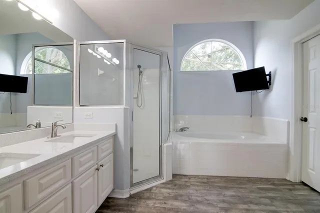 a bathroom with a bathtub and a sink