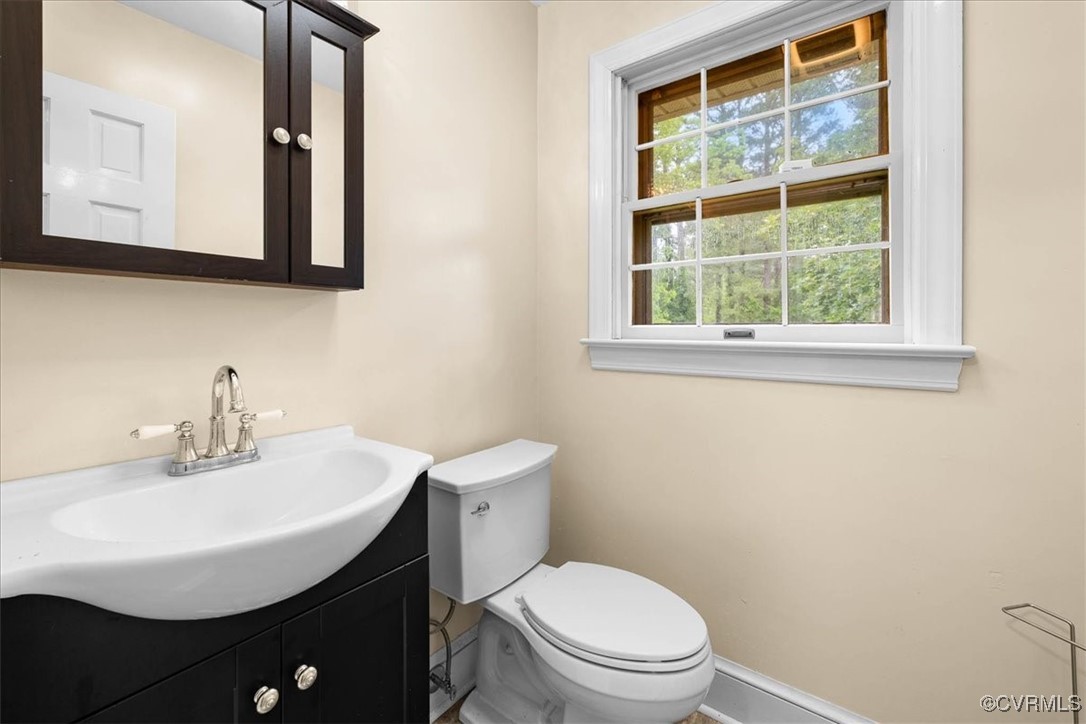 448 Jasper Lane Waverly, VA 23890 - Photo 11 of 44 a bathroom with a sink a mirror and a toilet