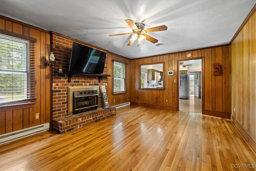448 Jasper Lane Waverly, VA 23890 - Photo 22 of 44 a view of a livingroom with wooden floor and a ceiling fan