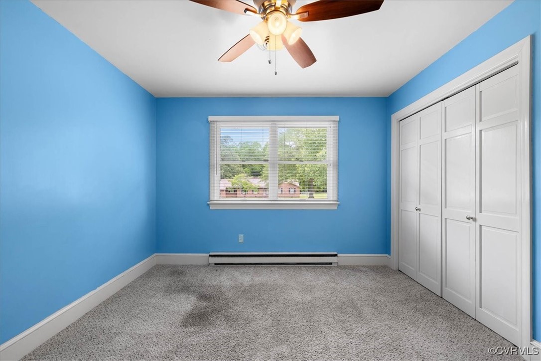 448 Jasper Lane Waverly, VA 23890 - Photo 23 of 44 an empty room with chandelier fan and windows