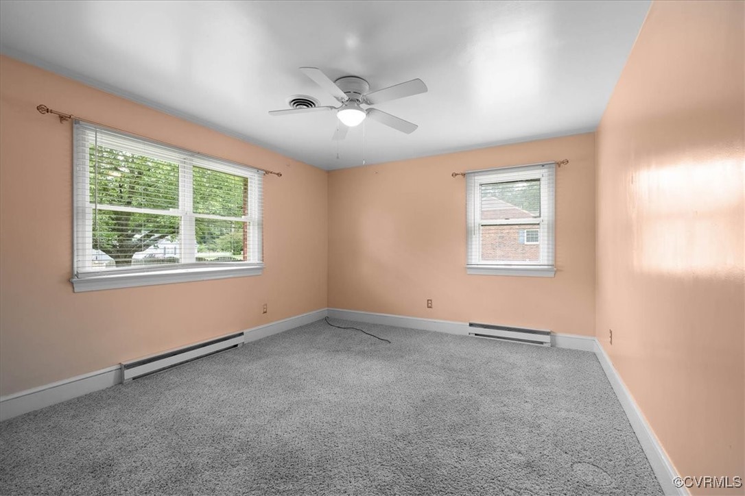 448 Jasper Lane Waverly, VA 23890 - Photo 25 of 44 an empty room with windows and fan