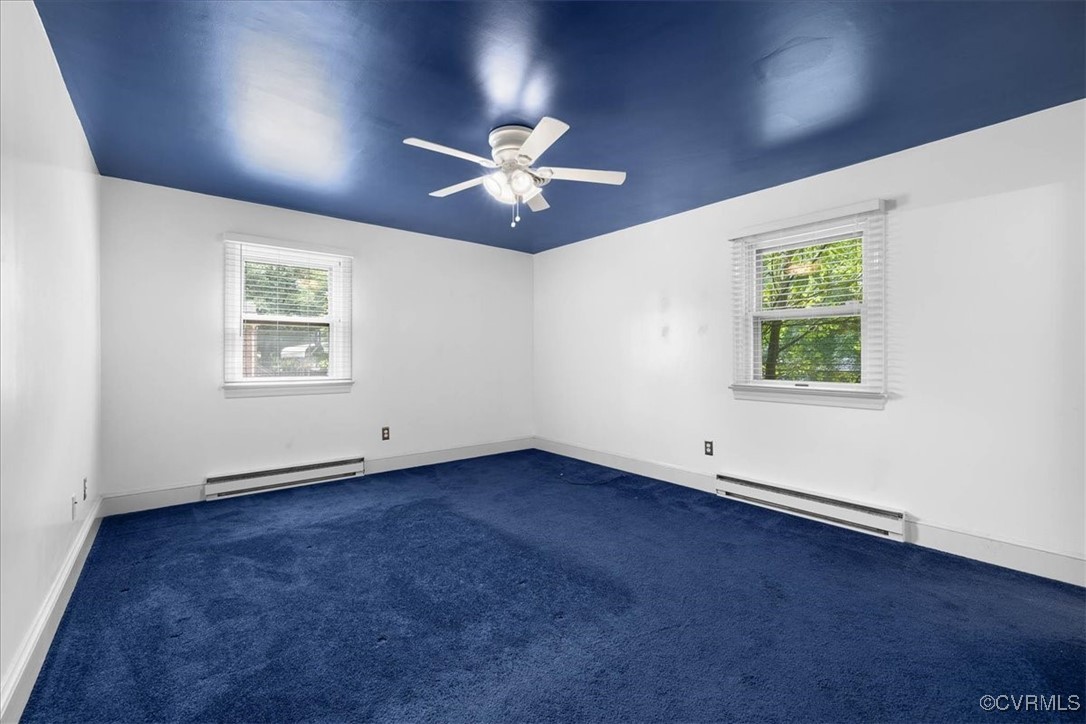 448 Jasper Lane Waverly, VA 23890 - Photo 27 of 44 an empty room with windows and fan